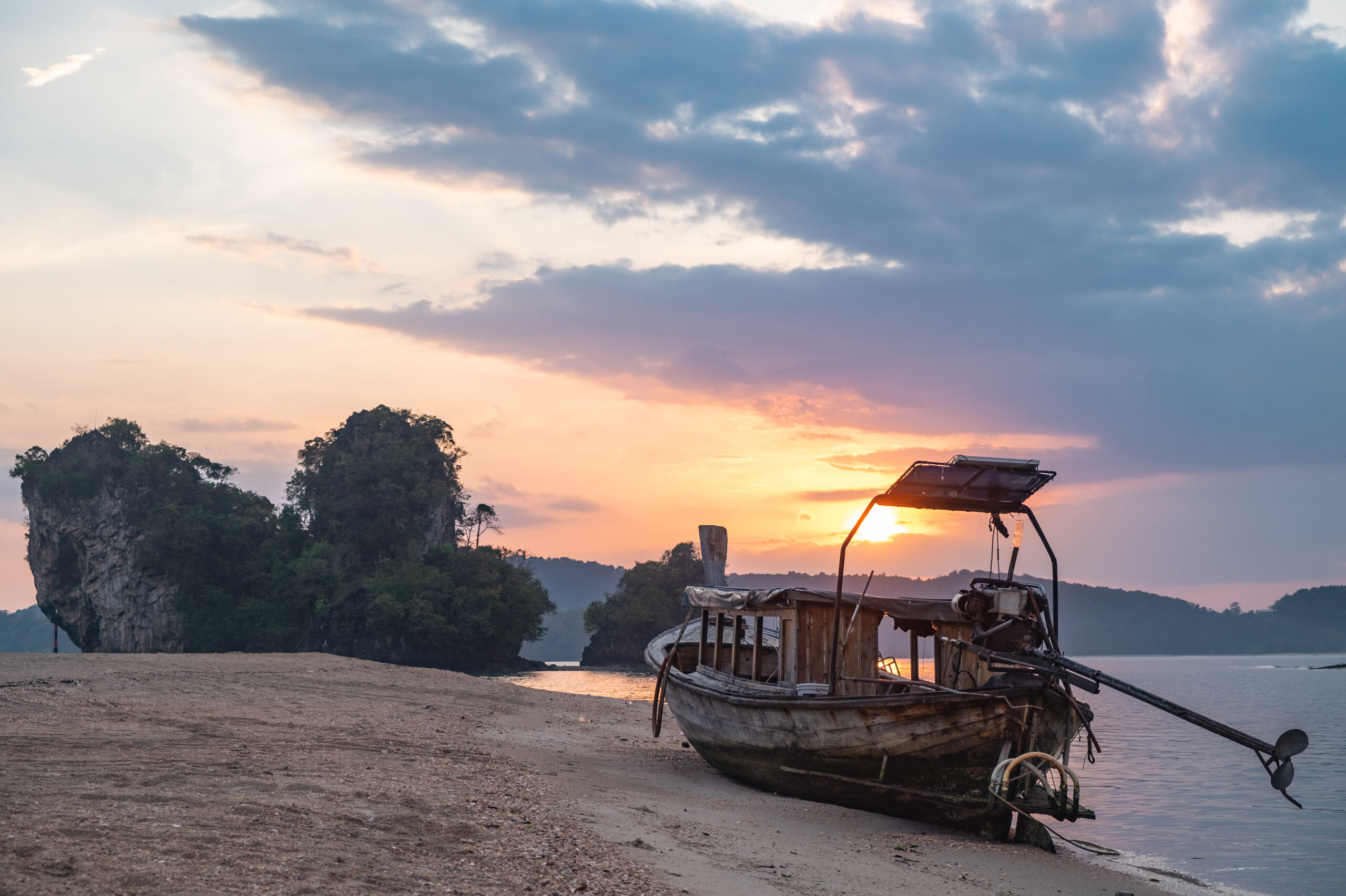 Thai sunset beach with boat